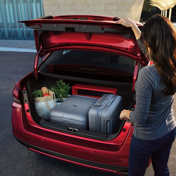 2024 Nissan Versa rear view of open trunk with luggage and groceries inside