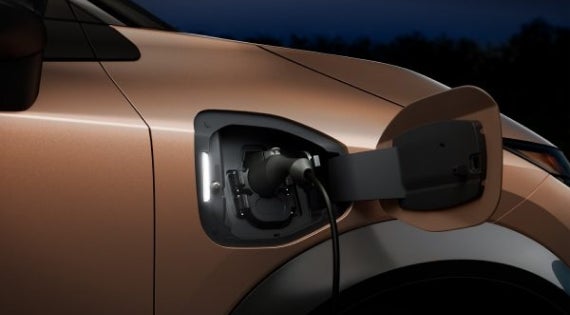 Close-up image of charging cable plugged in | Benton Nissan of Oxford in Oxford AL